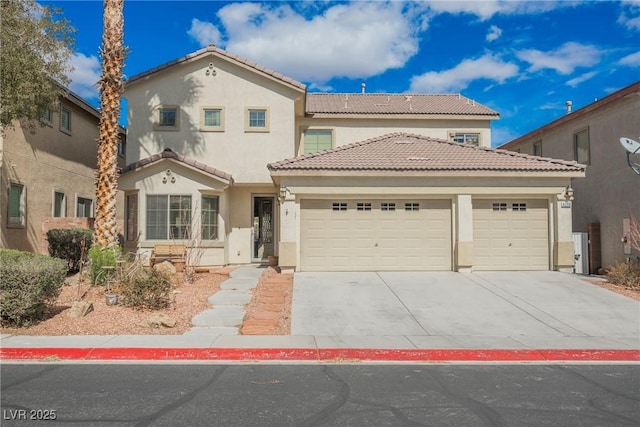 mediterranean / spanish house featuring a tile roof, an attached garage, driveway, and stucco siding