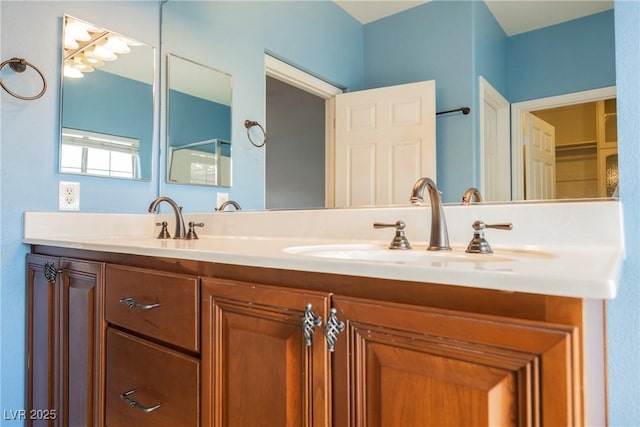 bathroom featuring double vanity and a sink