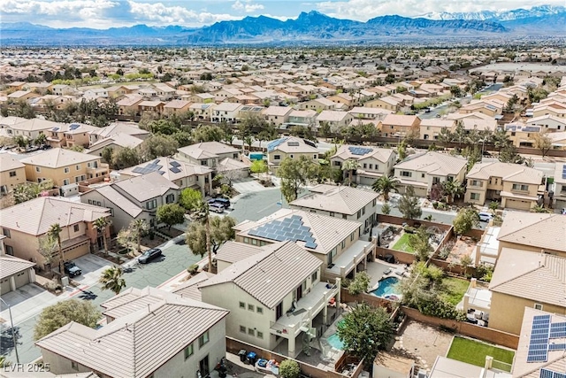 aerial view featuring a mountain view and a residential view