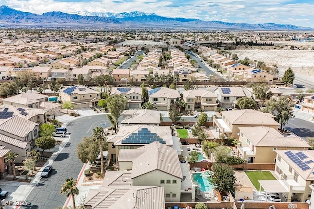 drone / aerial view featuring a residential view and a mountain view