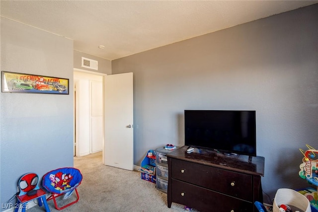 game room featuring visible vents and light carpet