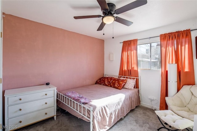 bedroom featuring baseboards, carpet, and a ceiling fan