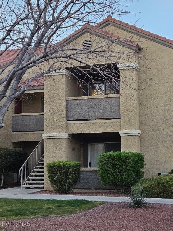 view of building exterior featuring stairway