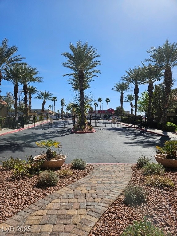 view of property's community featuring fence