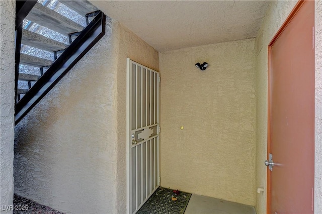 view of exterior entry featuring stucco siding