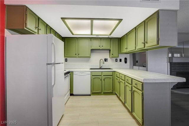 kitchen featuring green cabinetry and white appliances