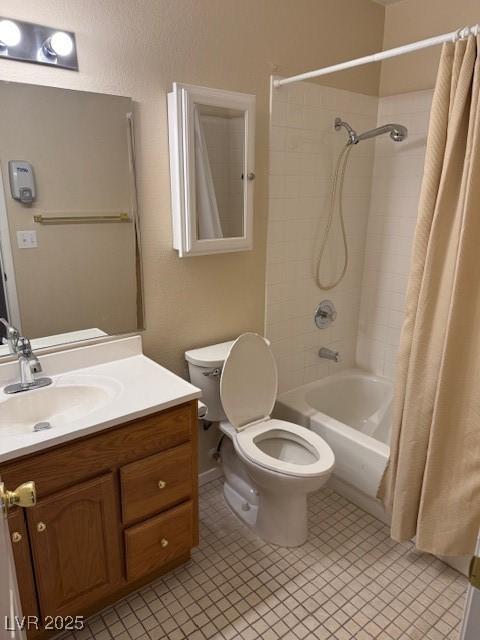 bathroom featuring vanity, toilet, and shower / bath combo with shower curtain