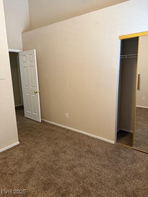 unfurnished bedroom with a closet, baseboards, and carpet flooring