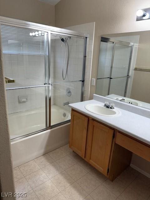 full bathroom featuring vanity and combined bath / shower with glass door