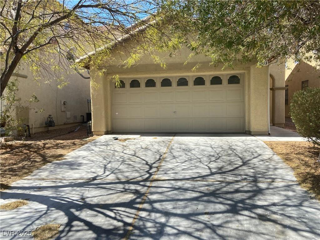 garage featuring driveway