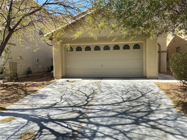 garage featuring driveway