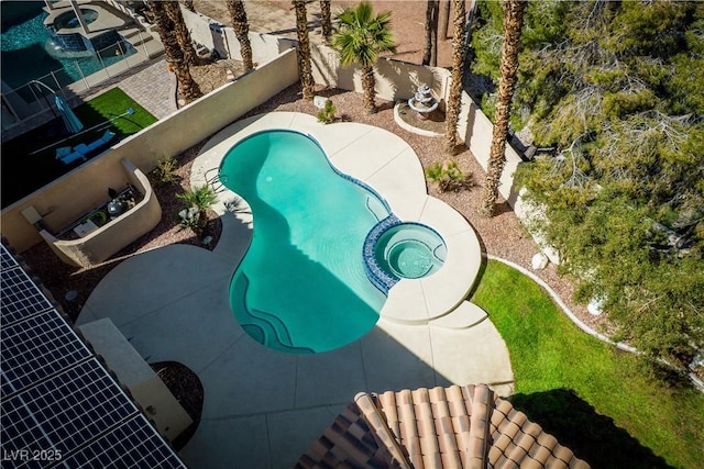 view of swimming pool featuring a fenced backyard