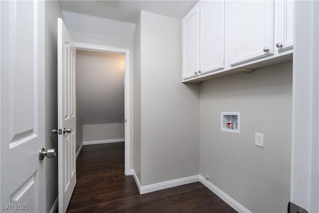 washroom featuring cabinet space, hookup for a washing machine, baseboards, and dark wood-style flooring