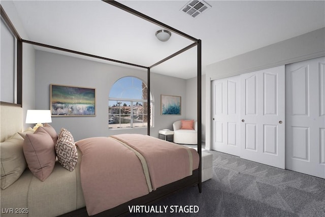 bedroom with a closet, visible vents, and carpet floors