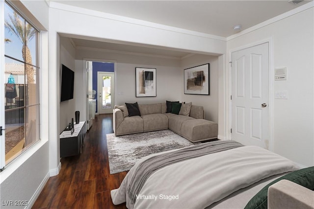 living room with visible vents, crown molding, dark wood-type flooring, and baseboards