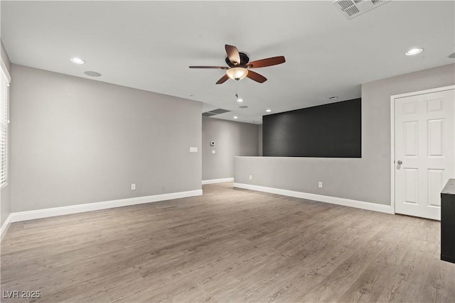 empty room featuring visible vents, ceiling fan, baseboards, light wood-type flooring, and recessed lighting