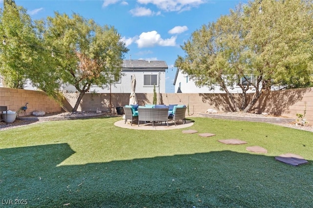 view of yard with a patio area and a fenced backyard