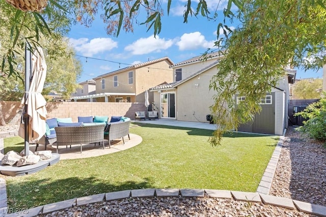 back of property featuring a patio, fence, an outdoor living space, stucco siding, and a lawn