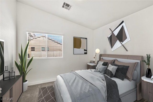 carpeted bedroom with visible vents, baseboards, and vaulted ceiling