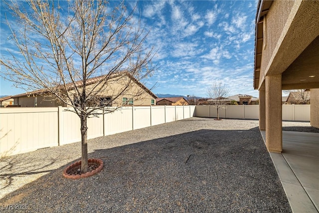 view of yard featuring a patio and a fenced backyard