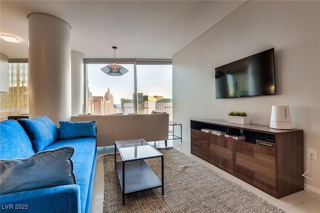 living area featuring tile patterned flooring and a healthy amount of sunlight