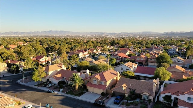 drone / aerial view featuring a mountain view and a residential view