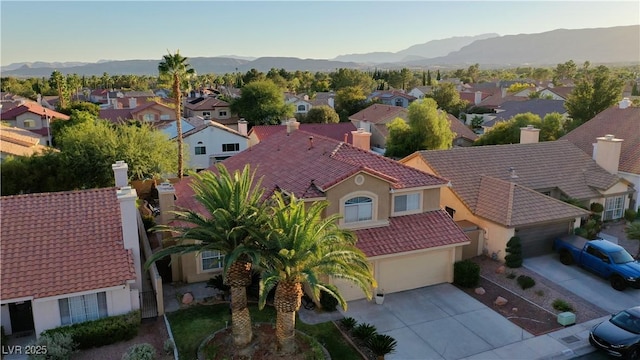 bird's eye view with a mountain view and a residential view