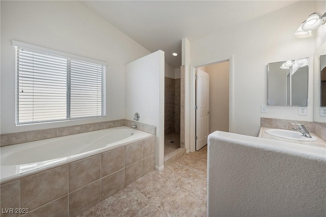 full bath with tile patterned floors, a stall shower, vanity, and a garden tub