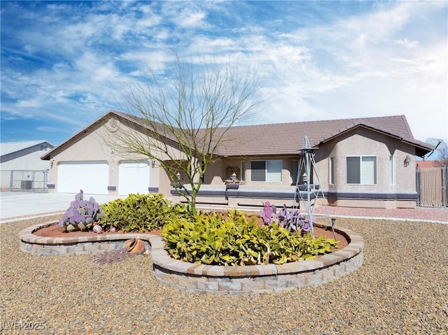 single story home featuring stucco siding, a garage, driveway, and a tile roof