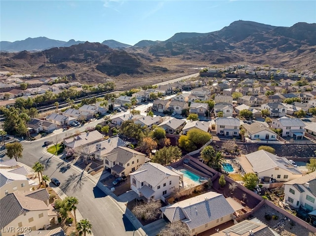 birds eye view of property with a mountain view and a residential view