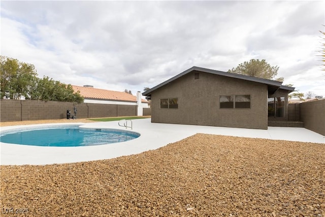 view of swimming pool with a patio, a fenced backyard, and a fenced in pool