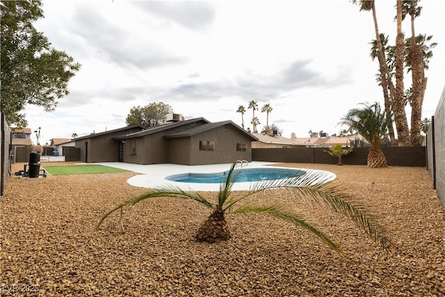 view of pool featuring a patio area, a fenced backyard, and a fenced in pool