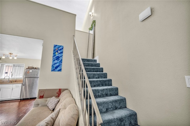 stairway with wood finished floors