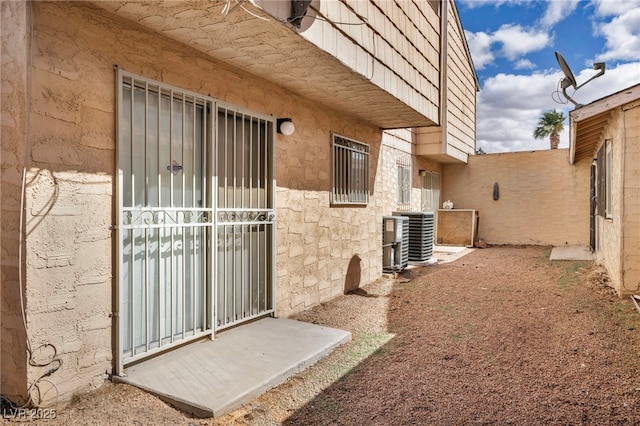 property entrance featuring central air condition unit