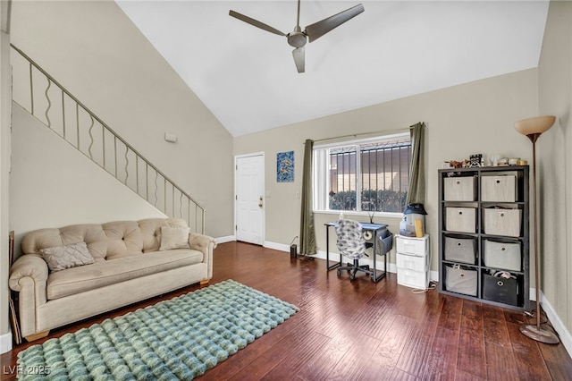 living area with stairway, baseboards, a ceiling fan, and wood finished floors