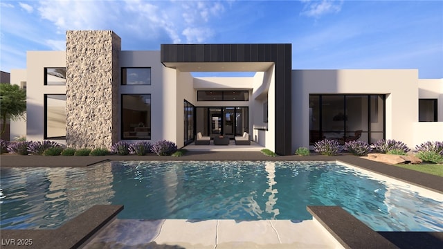 rear view of house featuring stucco siding, an outdoor pool, and a patio