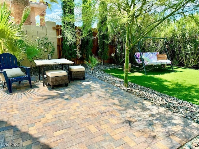 view of patio featuring fence