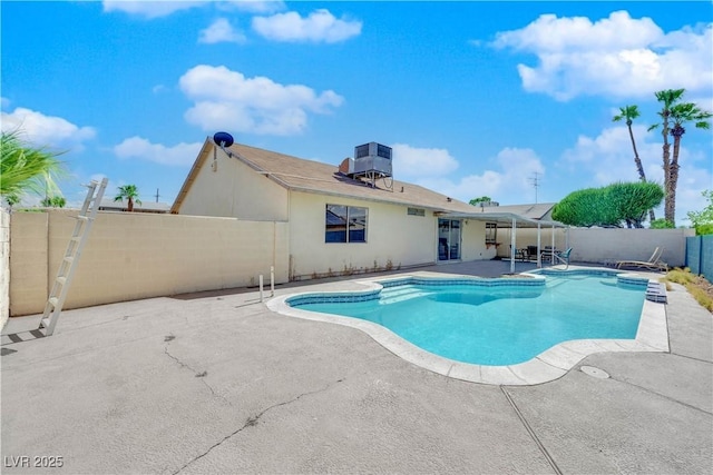 view of swimming pool featuring a fenced in pool, a patio, central AC, and a fenced backyard