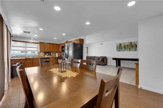 dining space featuring recessed lighting and visible vents