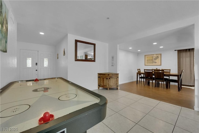 rec room with light tile patterned floors and recessed lighting