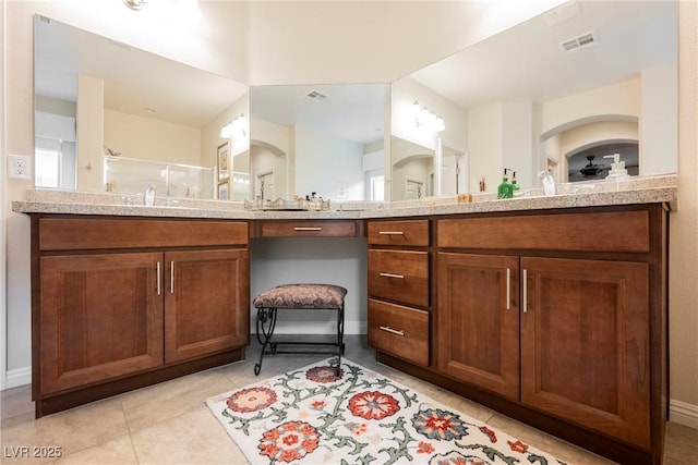 full bath with vanity, tile patterned floors, visible vents, and a stall shower