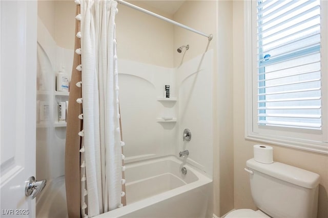 bathroom with shower / bathtub combination with curtain and toilet