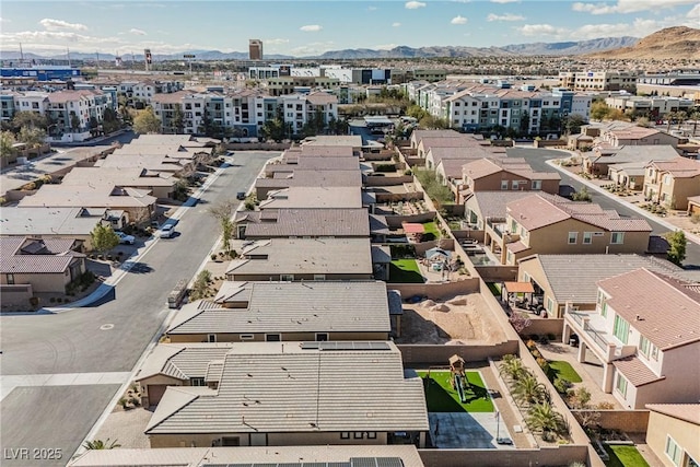 drone / aerial view featuring a residential view and a mountain view