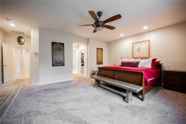 bedroom with recessed lighting, visible vents, arched walkways, and carpet floors