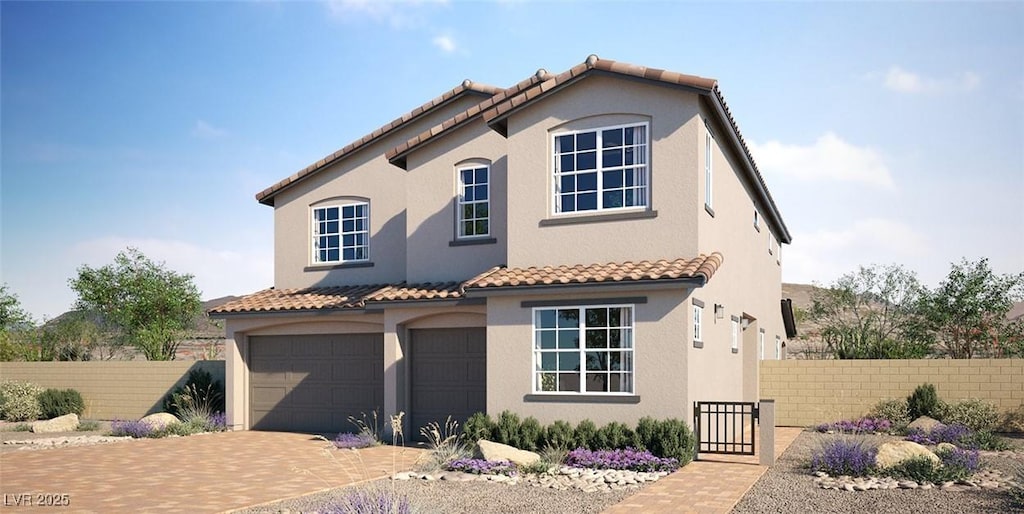 mediterranean / spanish home with stucco siding, decorative driveway, fence, a garage, and a tiled roof