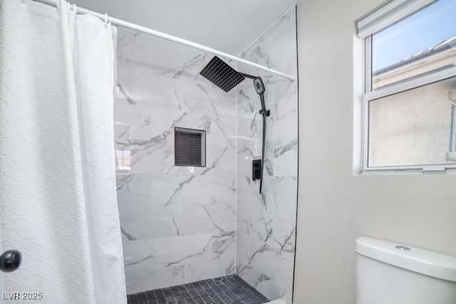 full bathroom featuring a marble finish shower, visible vents, and toilet