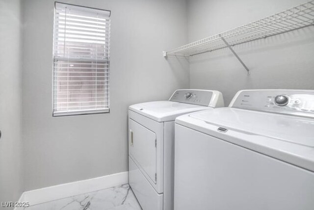 laundry room featuring laundry area, washer and dryer, marble finish floor, and baseboards