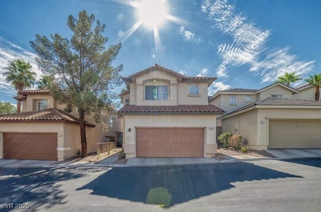 view of front of property with a tiled roof and stucco siding