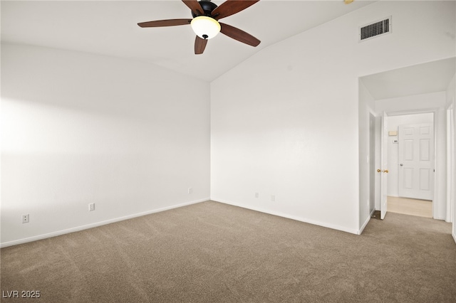 unfurnished room featuring visible vents, baseboards, lofted ceiling, and carpet