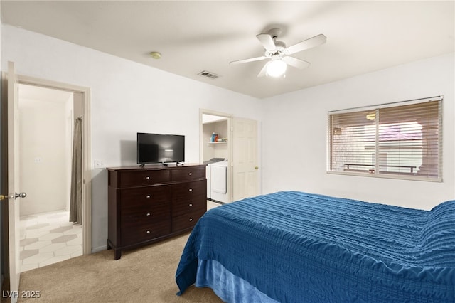 bedroom with light carpet, visible vents, washer / clothes dryer, and a ceiling fan